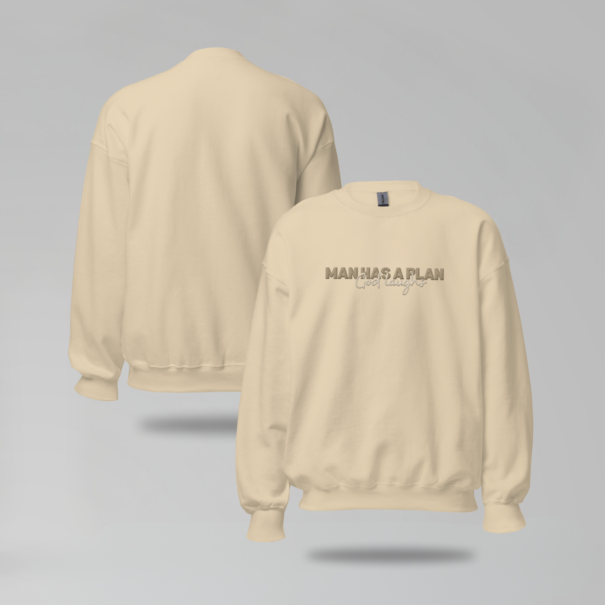 Man Has a Plan, God Laughs Embroidered Crewneck – Faith with a Sense of Humor - Designs by Smiley