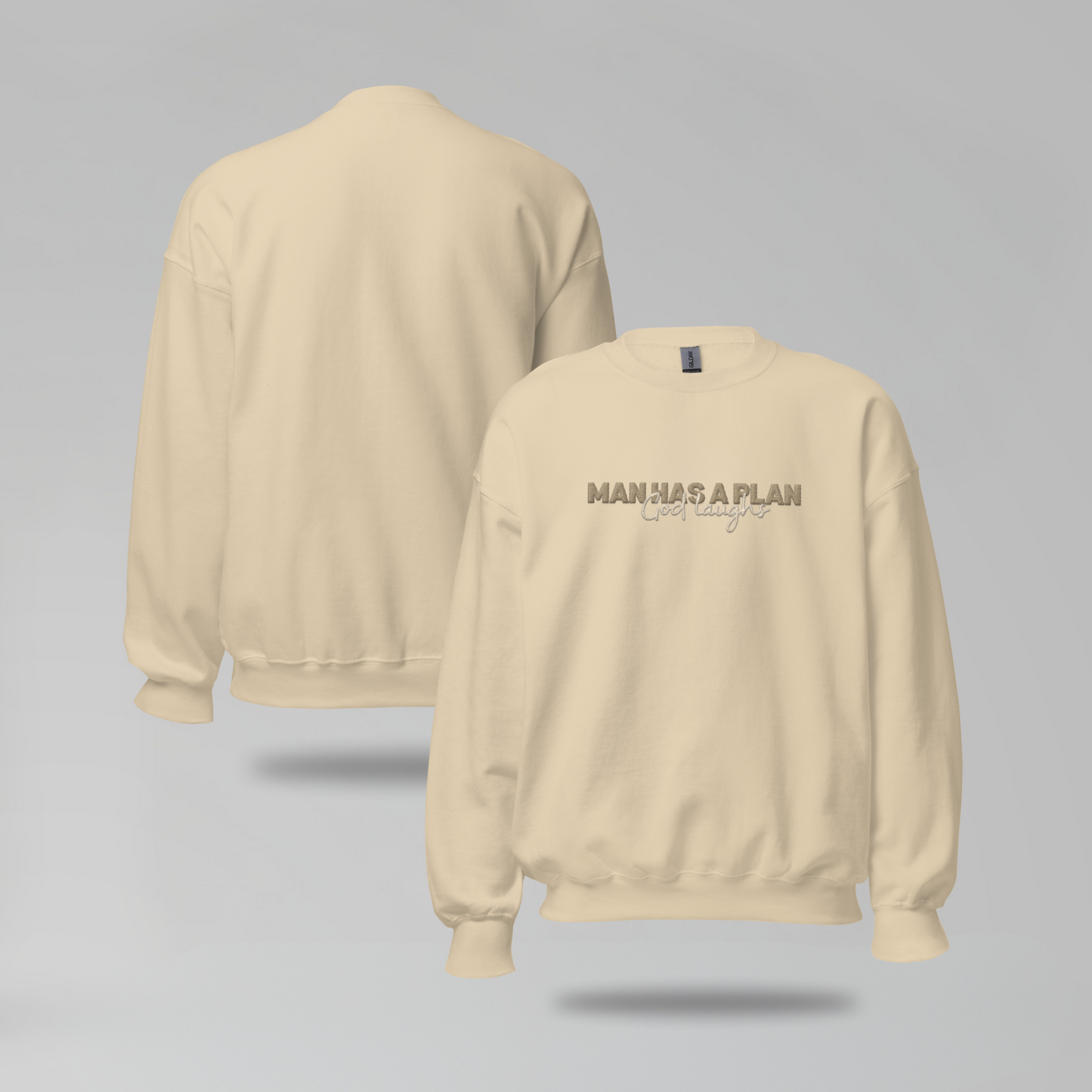 Man Has a Plan, God Laughs Embroidered Crewneck – Faith with a Sense of Humor - Designs by Smiley