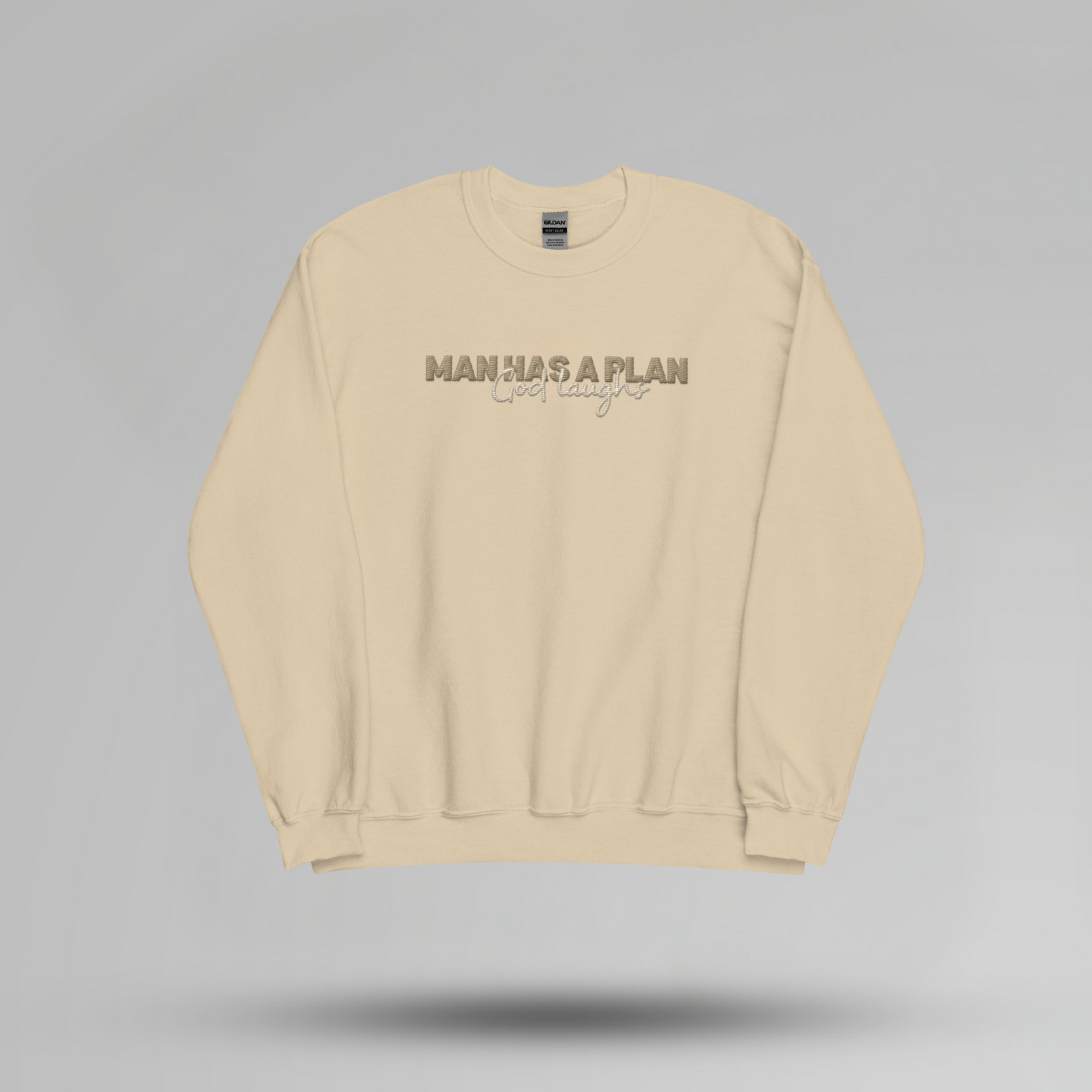 Man Has a Plan, God Laughs Embroidered Crewneck – Faith with a Sense of Humor - Designs by Smiley