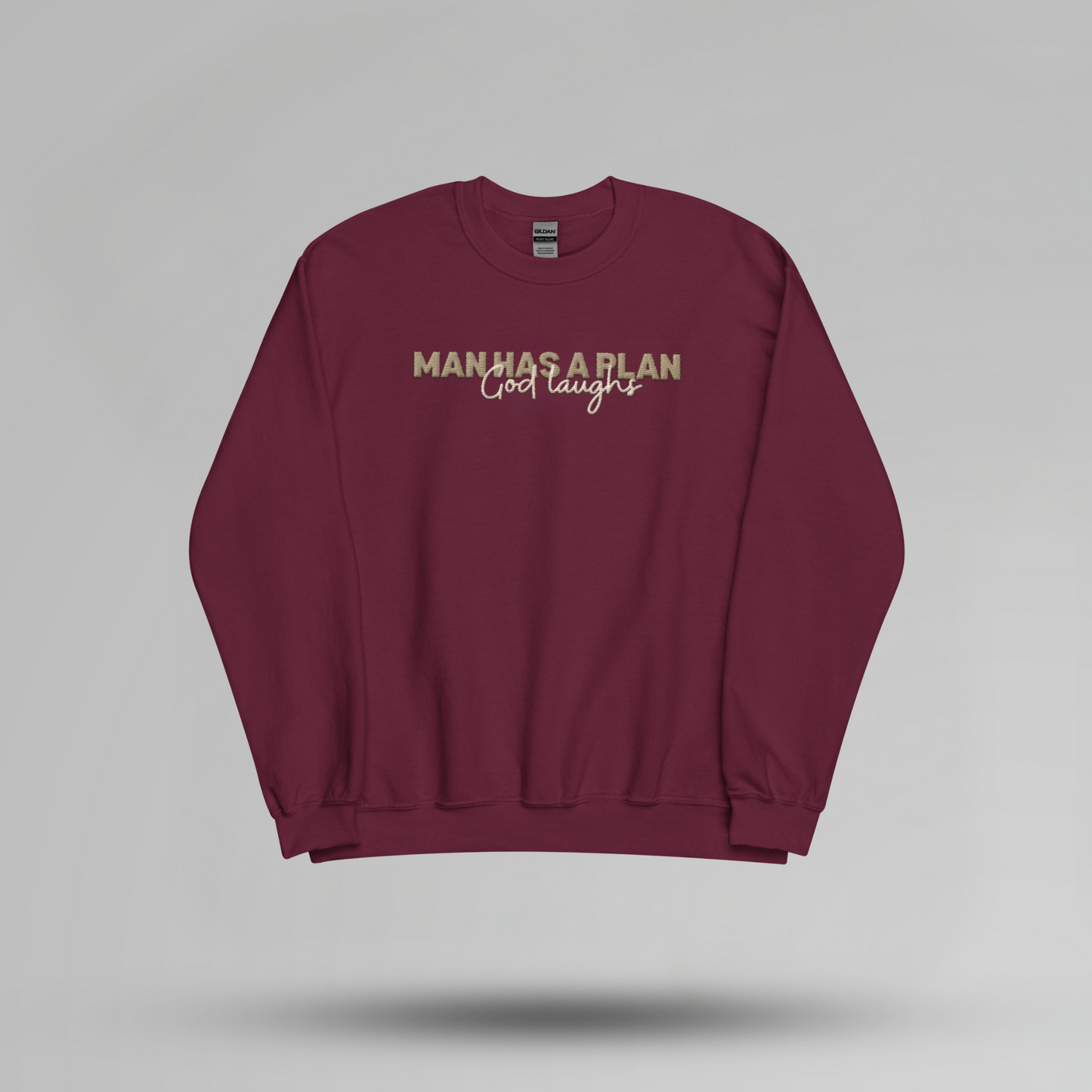 Man Has a Plan, God Laughs Embroidered Crewneck – Faith with a Sense of Humor - Designs by Smiley