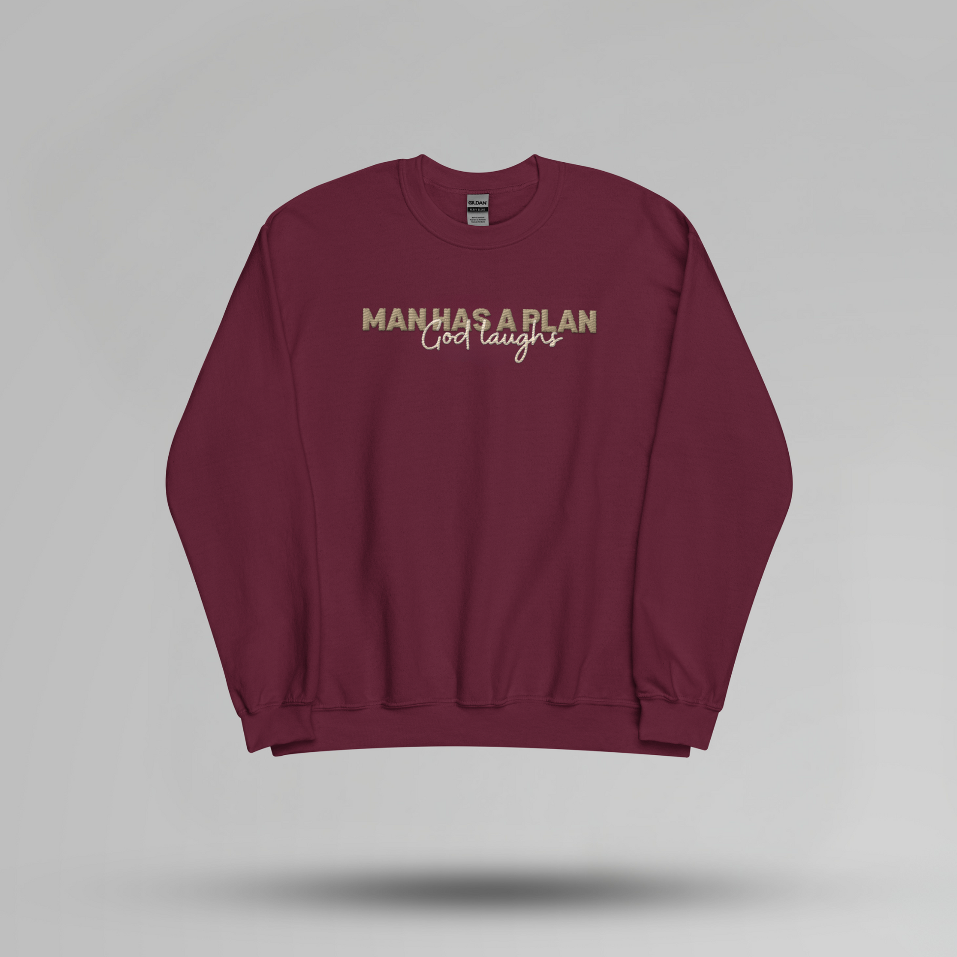 Man Has a Plan, God Laughs Embroidered Crewneck – Faith with a Sense of Humor - Designs by Smiley