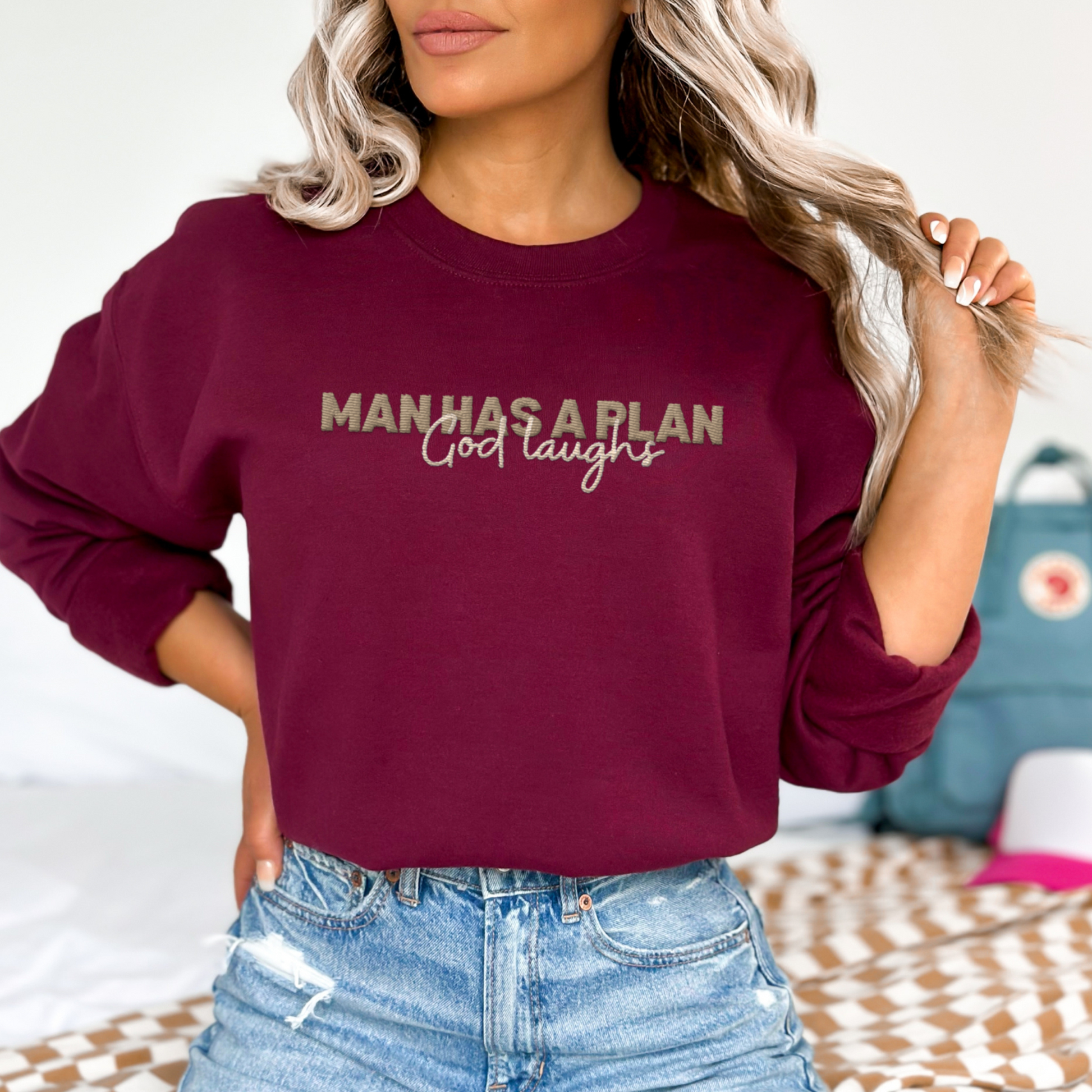 Man Has a Plan, God Laughs Embroidered Crewneck – Faith with a Sense of Humor - Designs by Smiley
