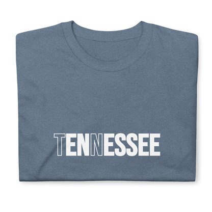 Folded blue t-shirt with 'TENNESSEE' printed on it against a white background