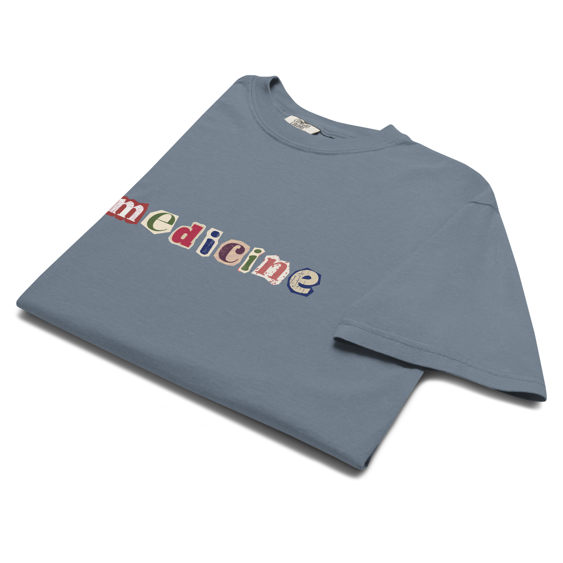 Blue t-shirt with colorful 'medicine' text on a white background